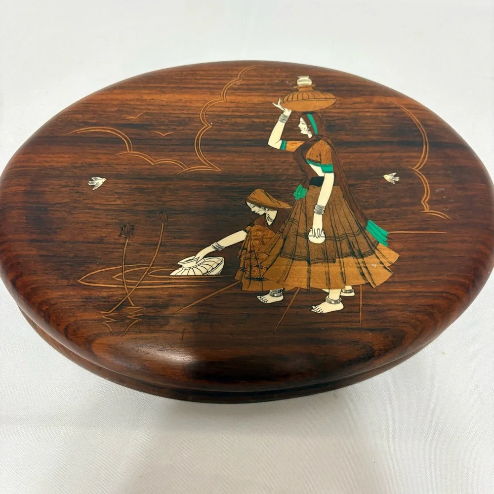 Vintage Indian rosewood wall art plaques with intricate bone inlay designs.